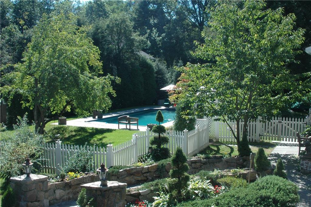 a backyard of a house with a yard and outdoor seating