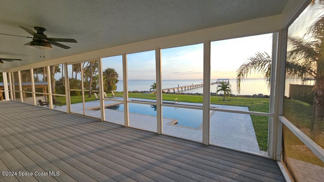 a view of a balcony with wooden floor