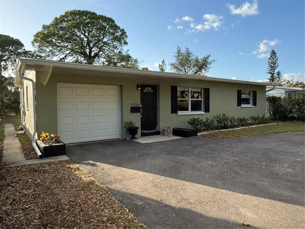 a view of a house with a garage