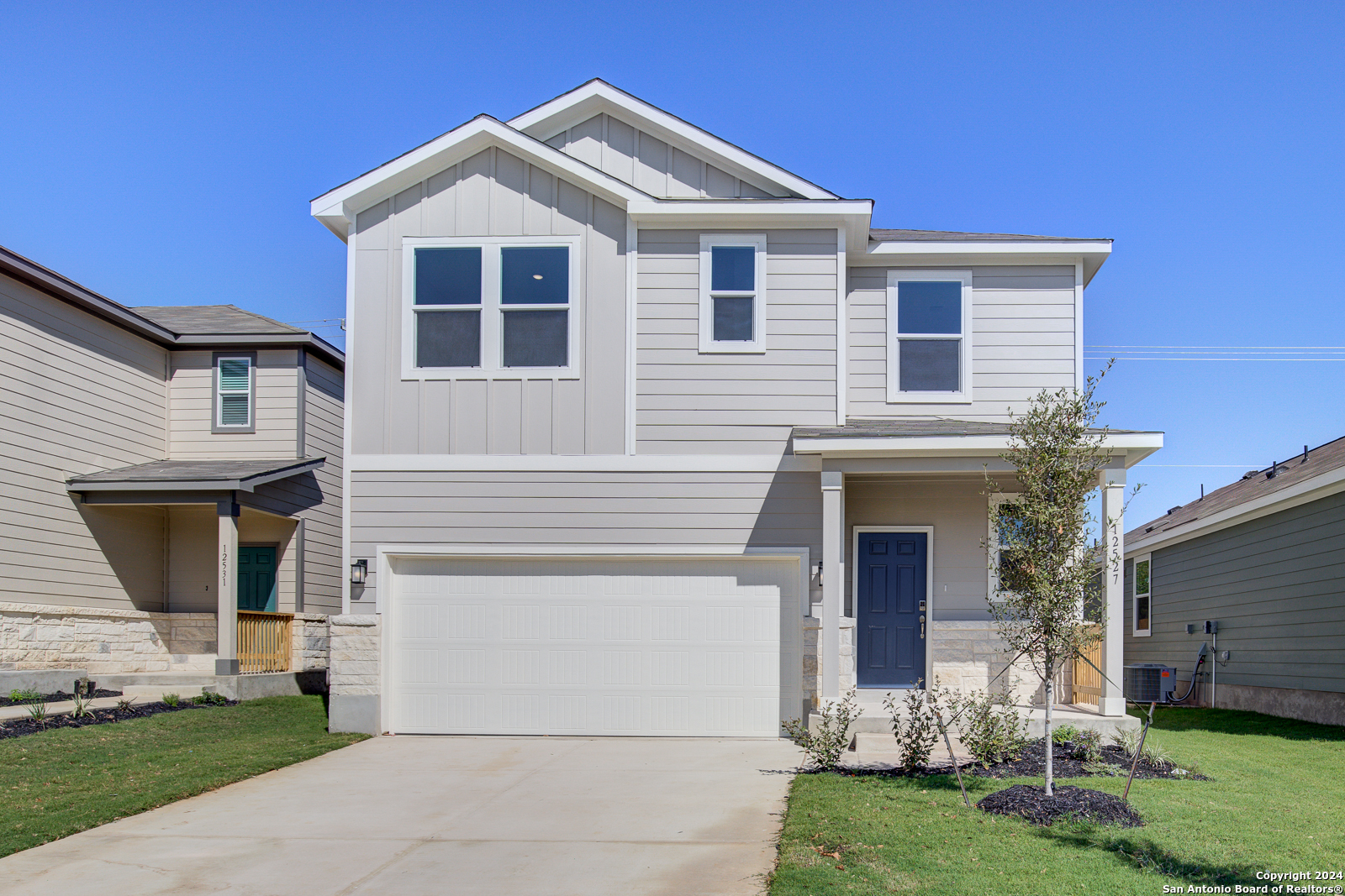 a front view of a house with a yard