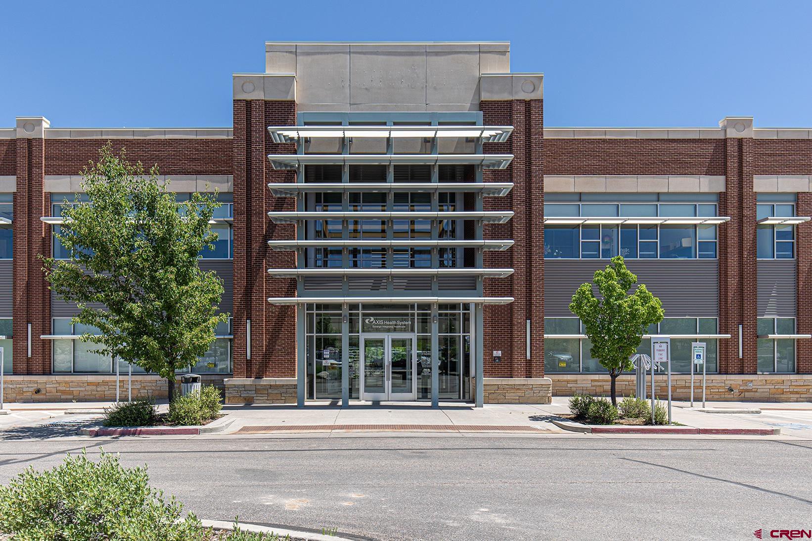 a front view of a building with street view