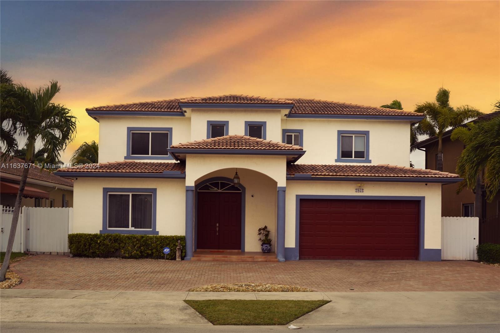 a front view of a house with a garage