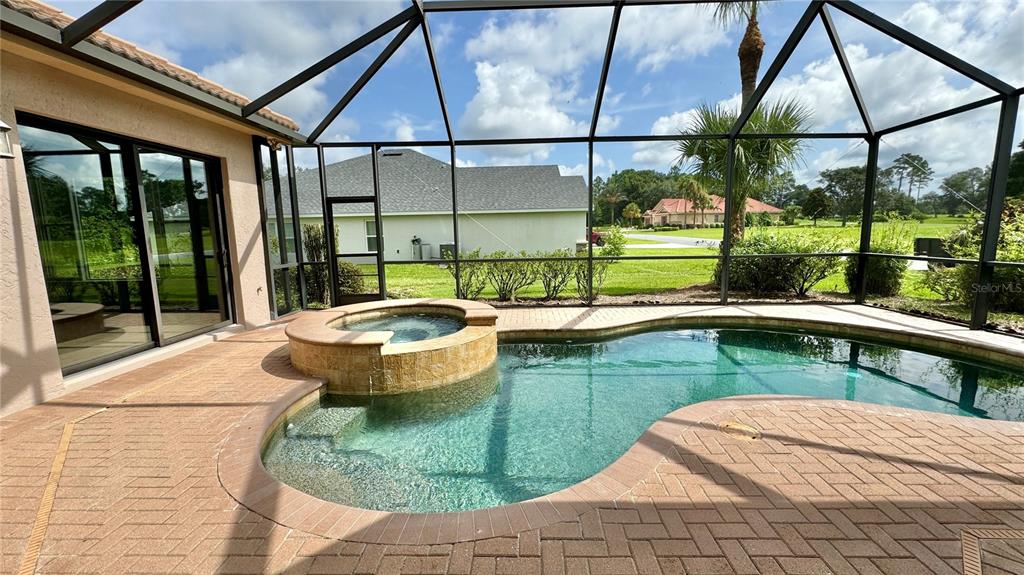 a view of a swimming pool with a patio