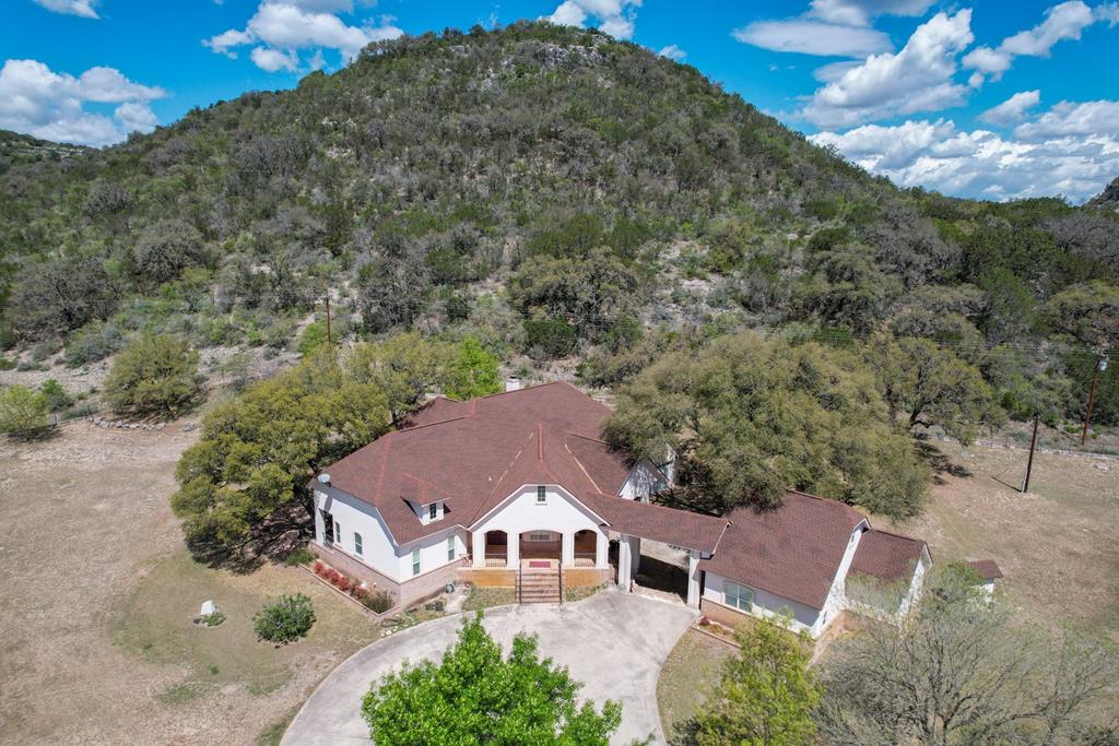 a aerial view of a house with a yard