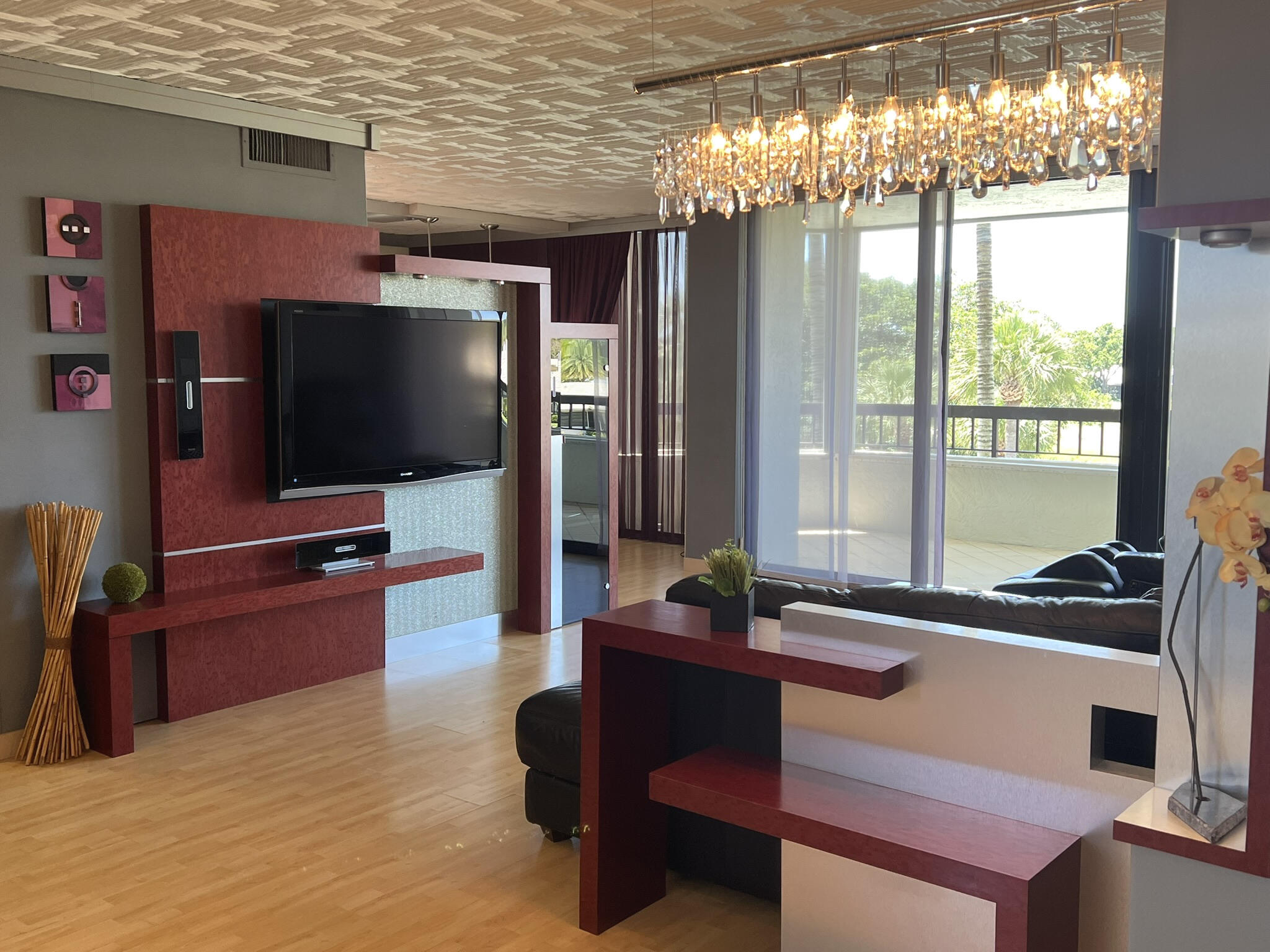 a living room with furniture and a flat screen tv