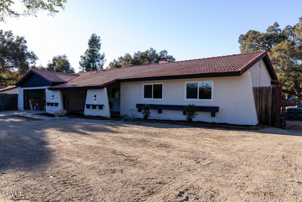 a house with trees in the background