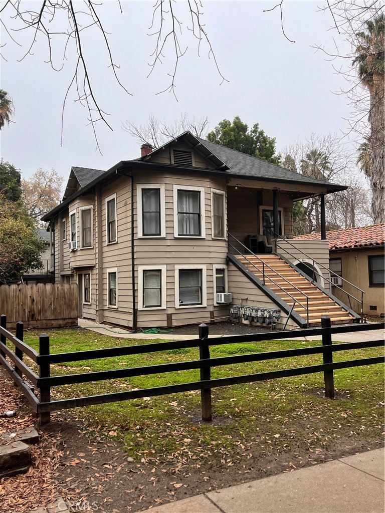 a small house with a bench in front of it