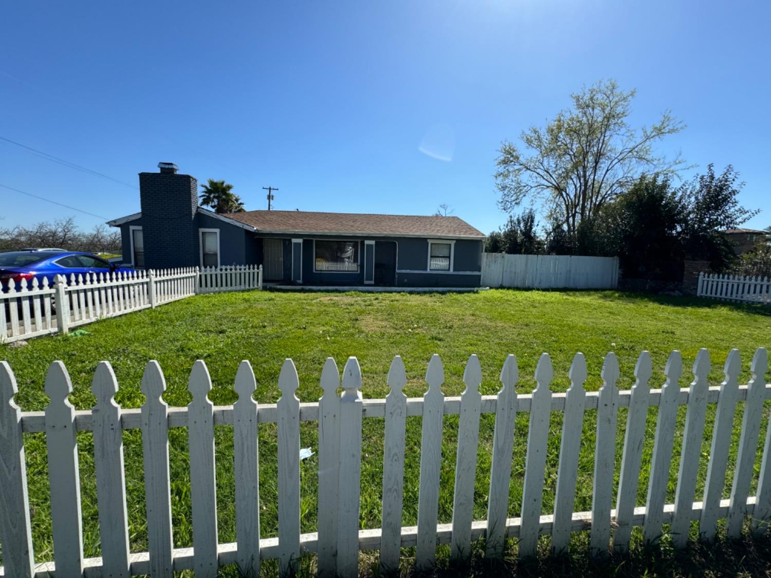 a view of a house with backyard of the house