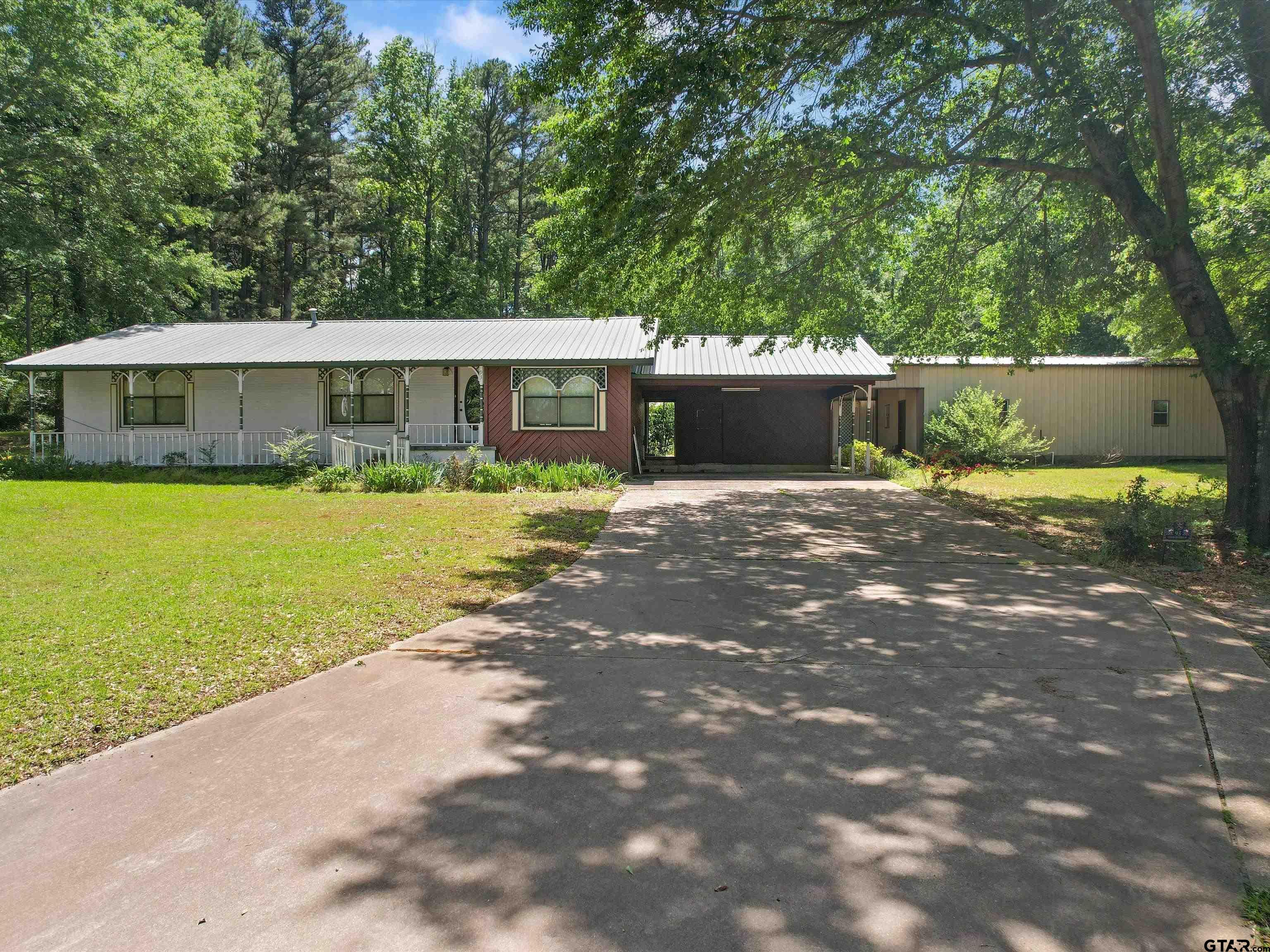 a front view of a house with yard