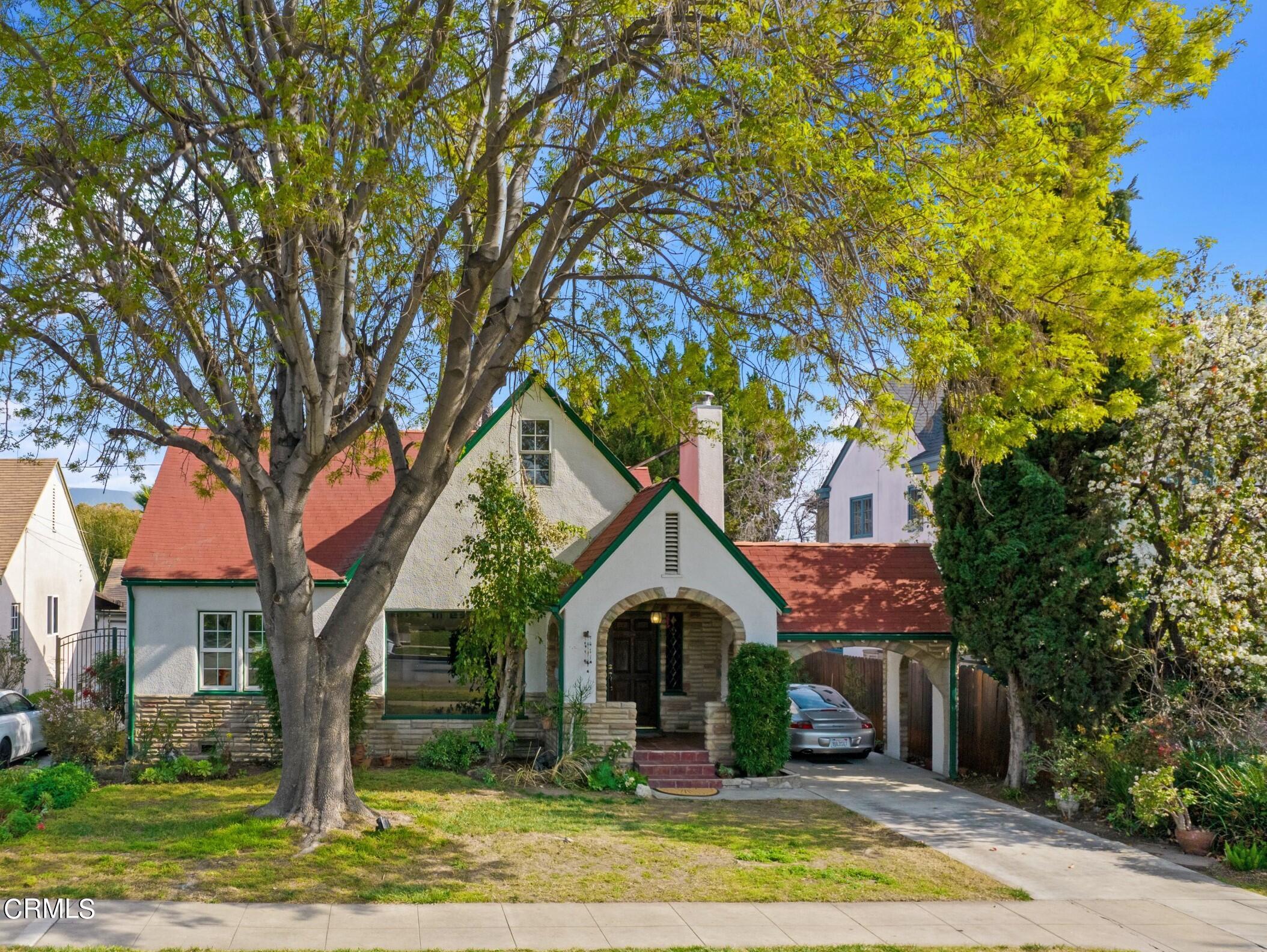 a front view of a house with garden