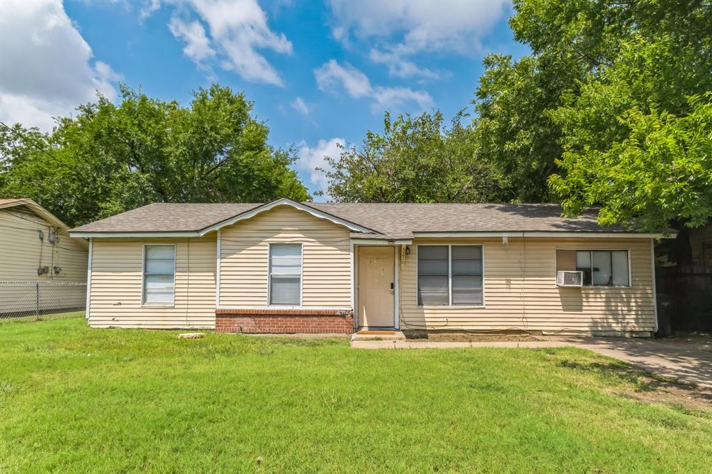 front view of a house with a yard