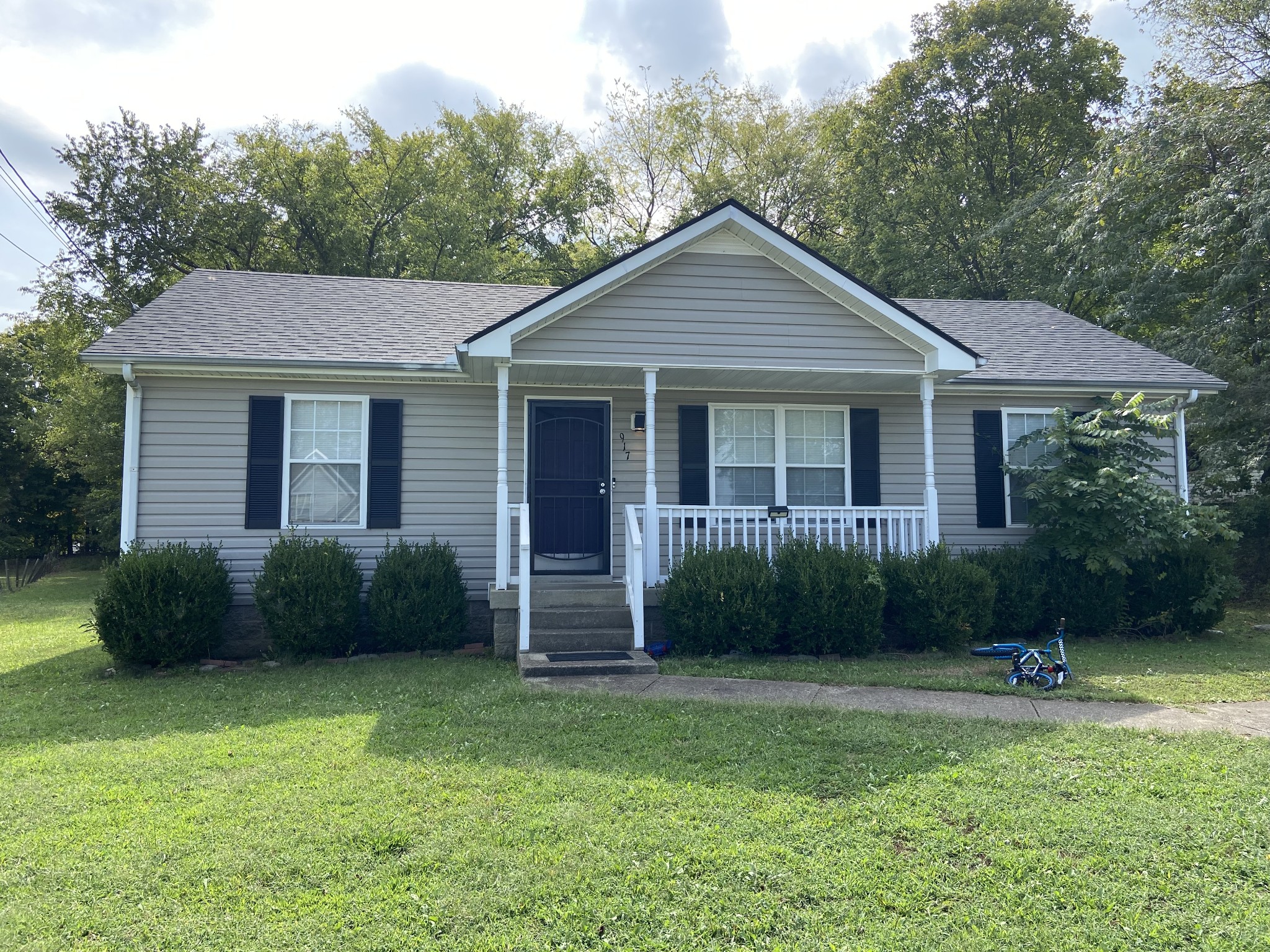 a front view of a house with a yard