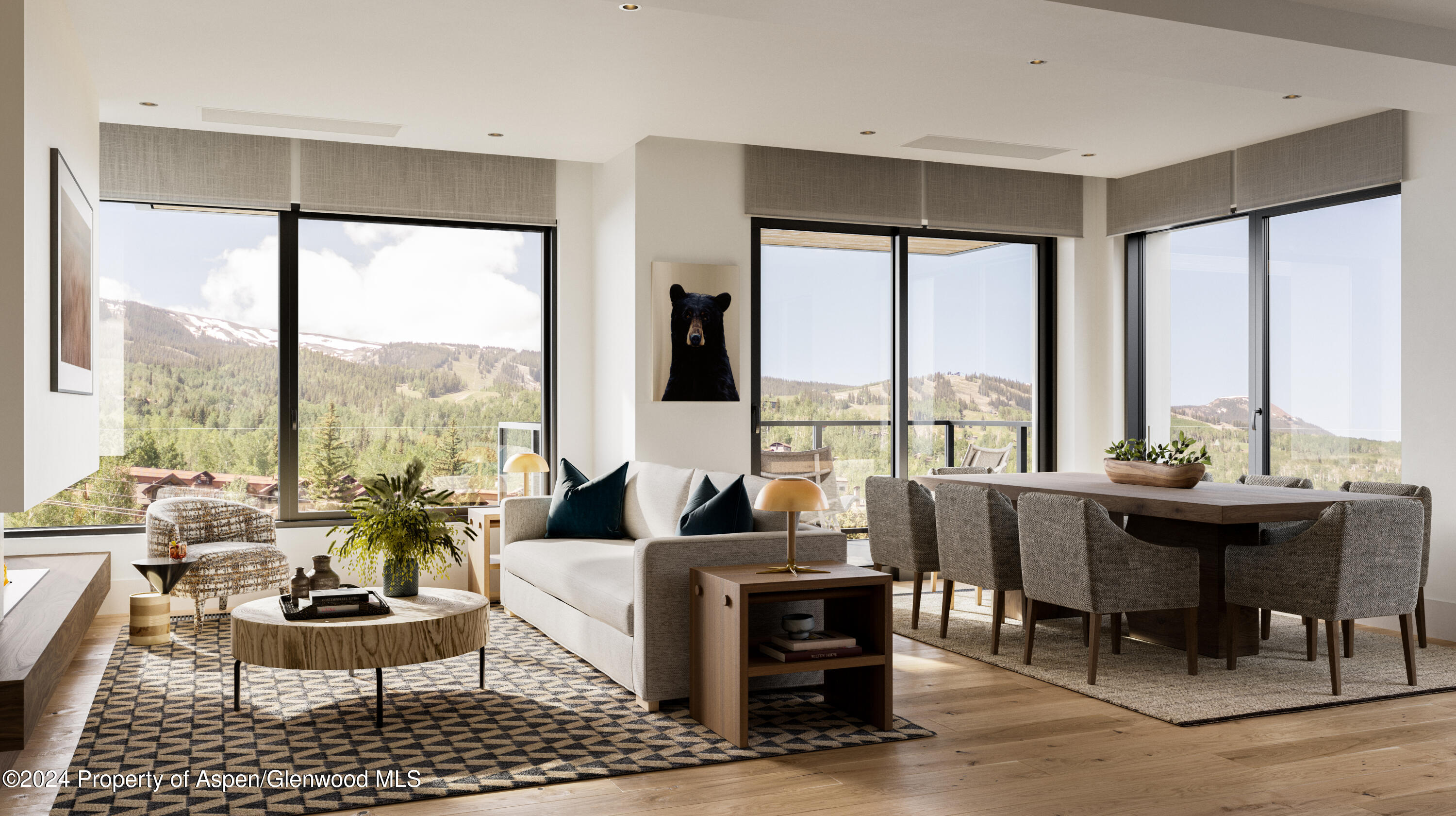 a living room with furniture and large windows