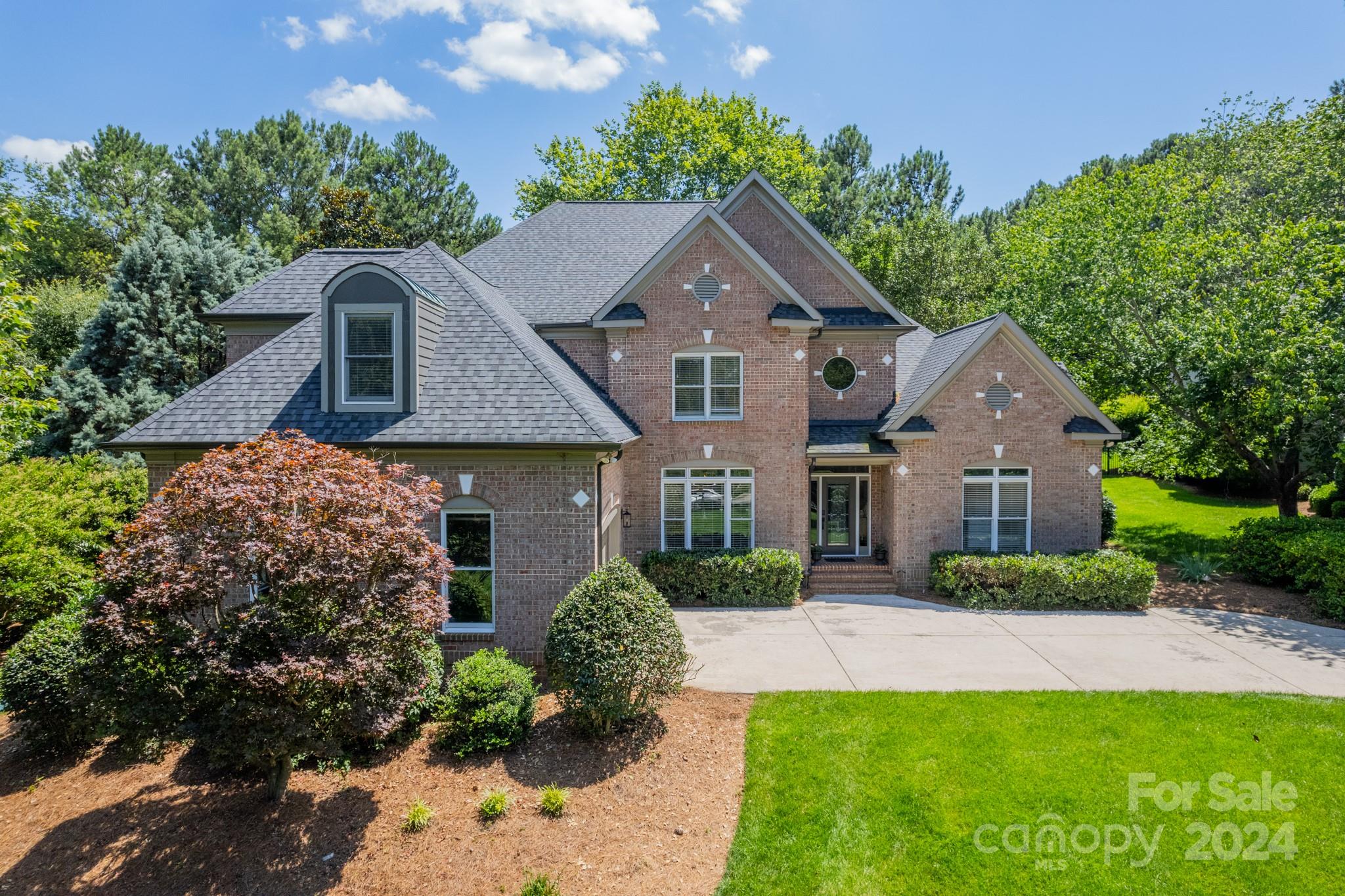 front view of a house with a yard