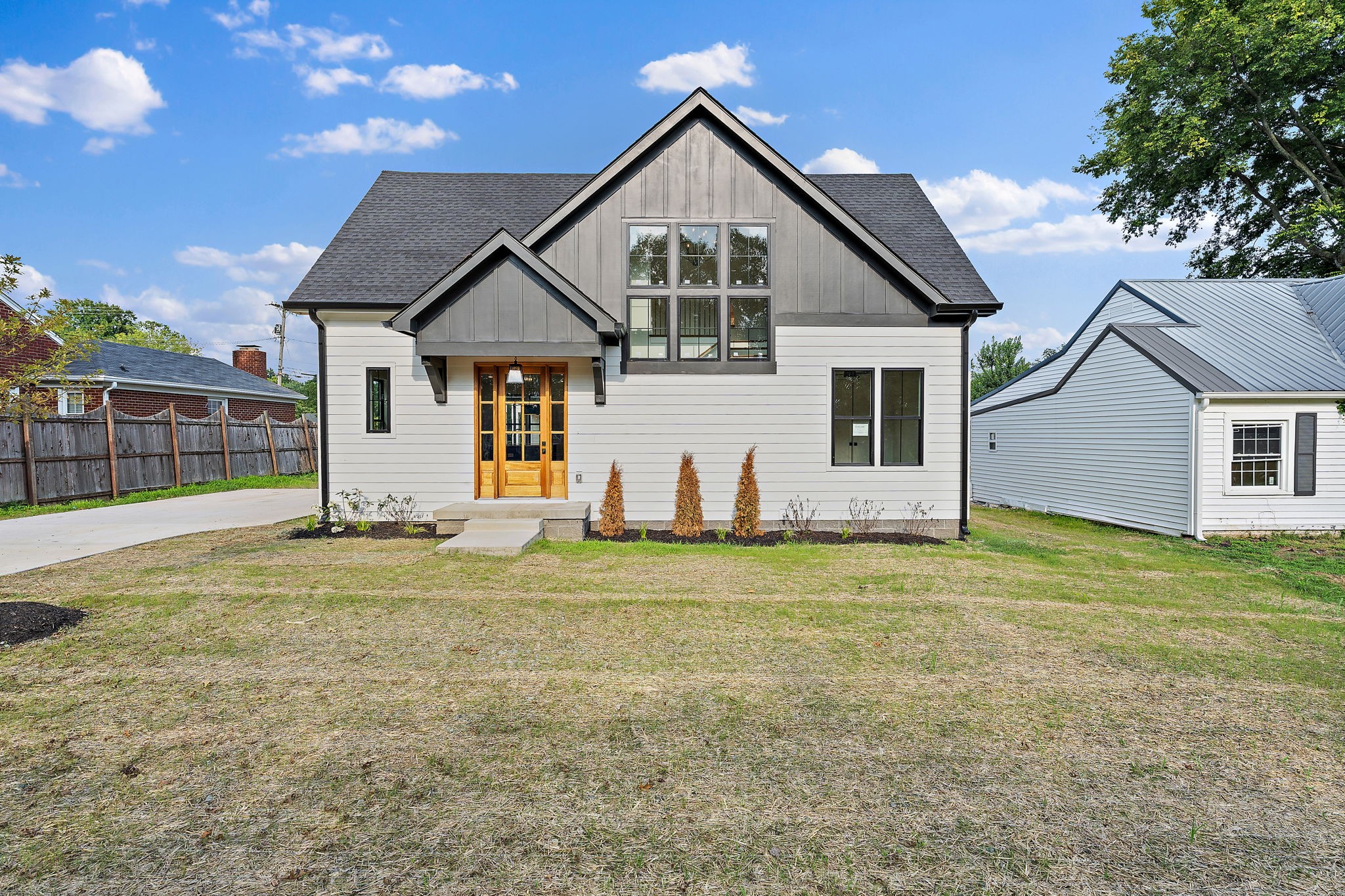 a front view of a house with a yard