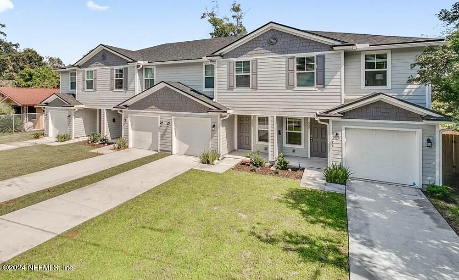 a front view of a house with yard patio and porch