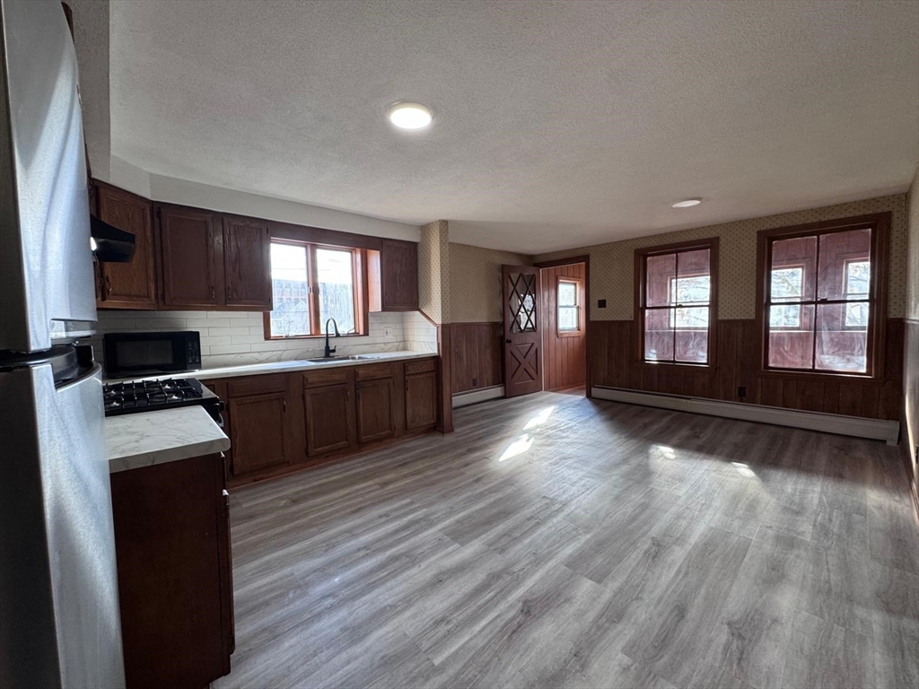 a view of a kitchen with a sink and a window