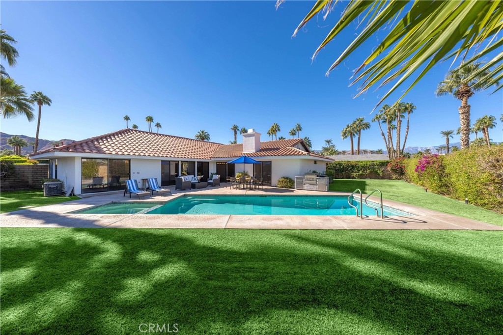 a front view of a house with a big yard