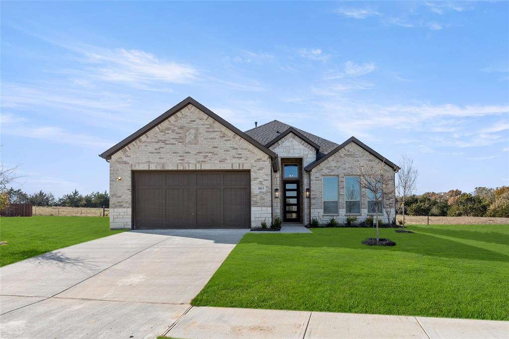 front view of a house with a yard