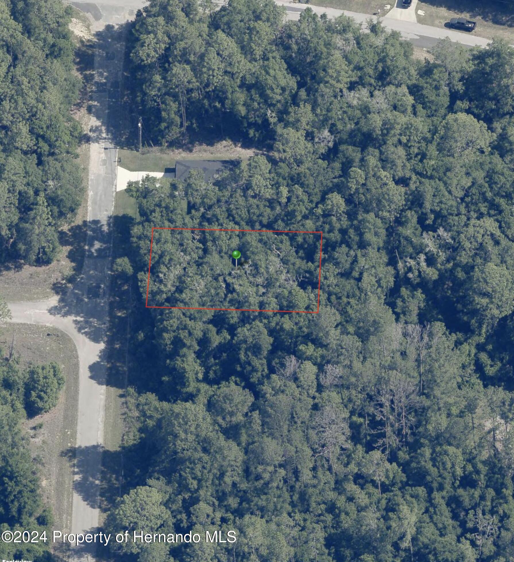 an aerial view of house with yard and mountain view