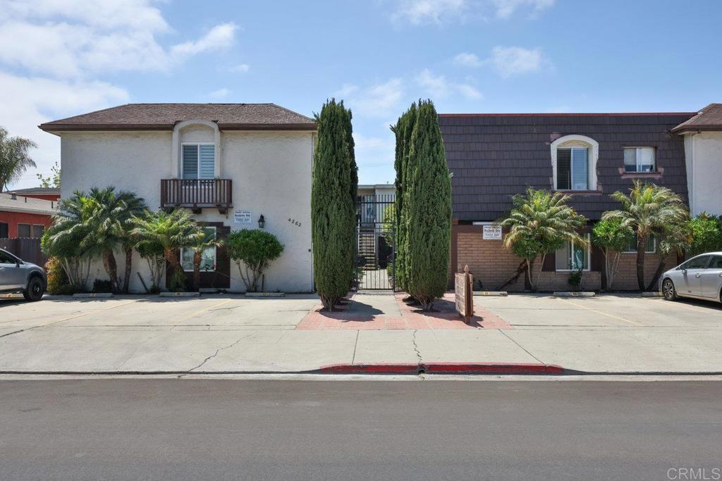 a potted plant sitting in front of a house