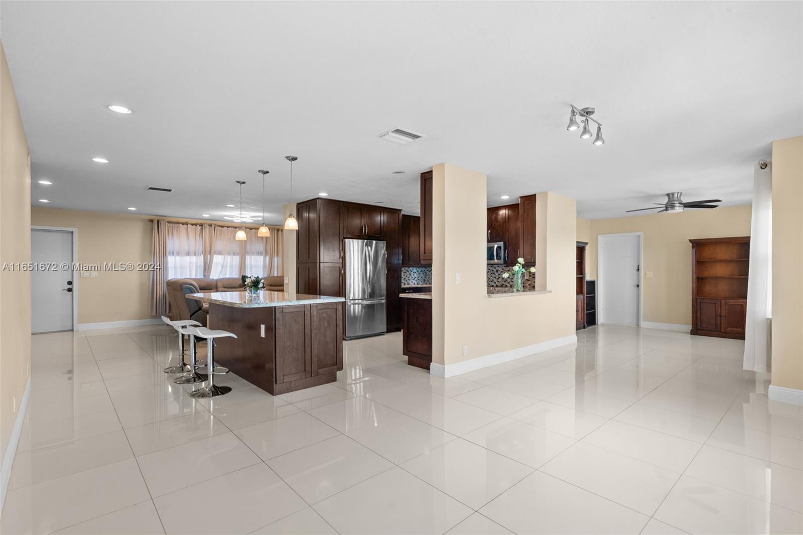 a view of a kitchen and dining room