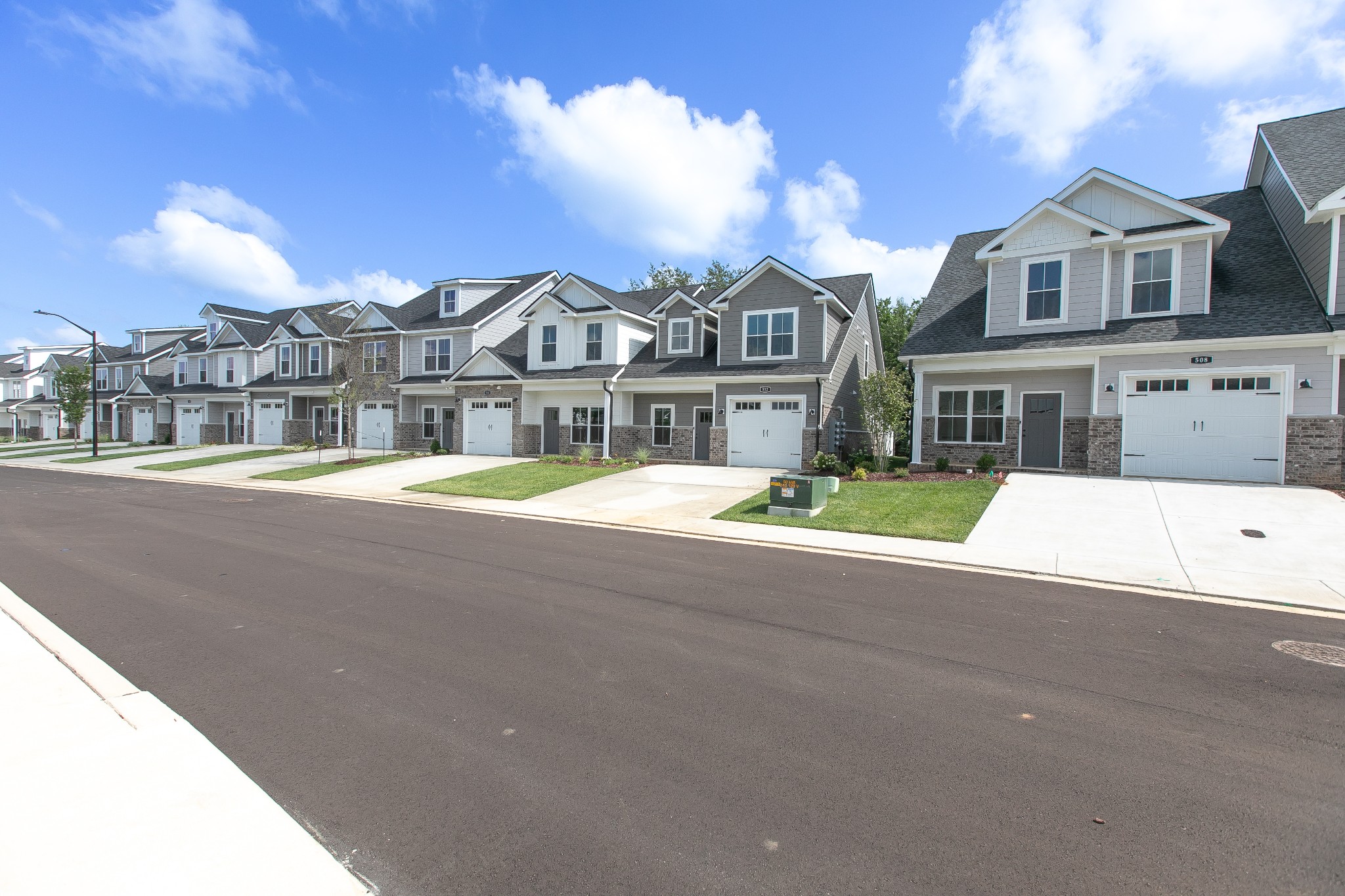 a view of multiple houses with a city street