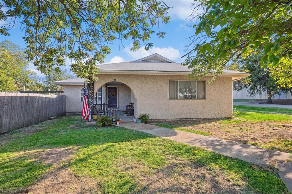 front view of a house with a yard