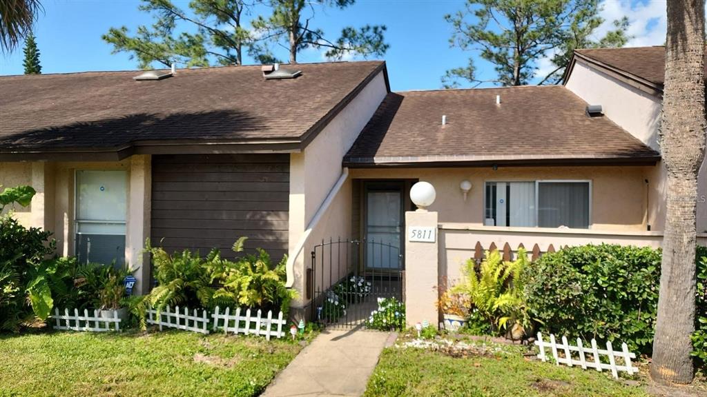 a front view of house with a yard