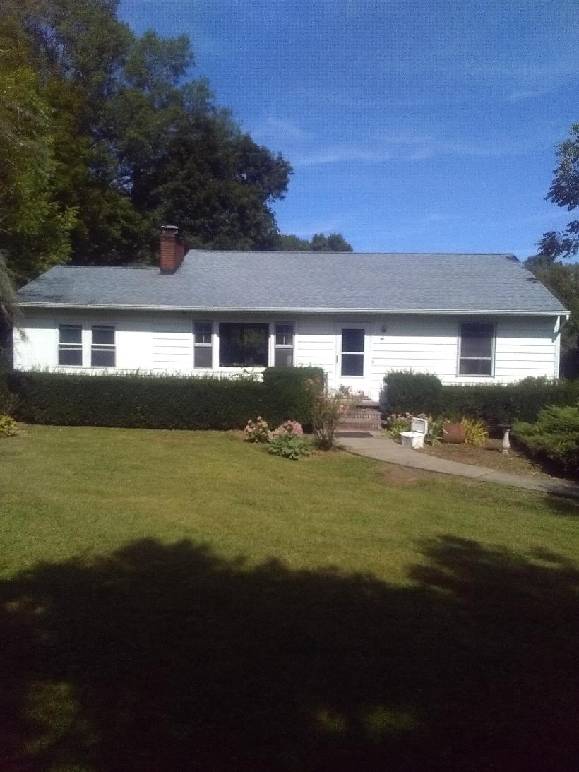 a view of house with garden