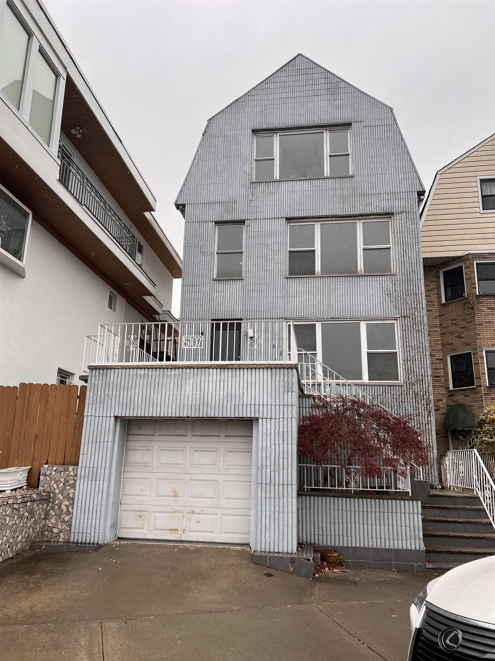 a front view of a house with a garage