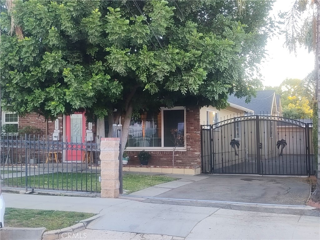 a front view of a house with a small garden