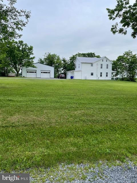 a view of a big house with a big yard