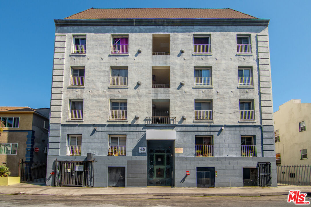 a front view of a building with many windows