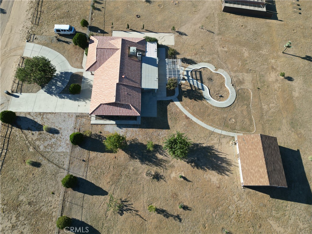 an aerial view of a residential apartment building with a yard