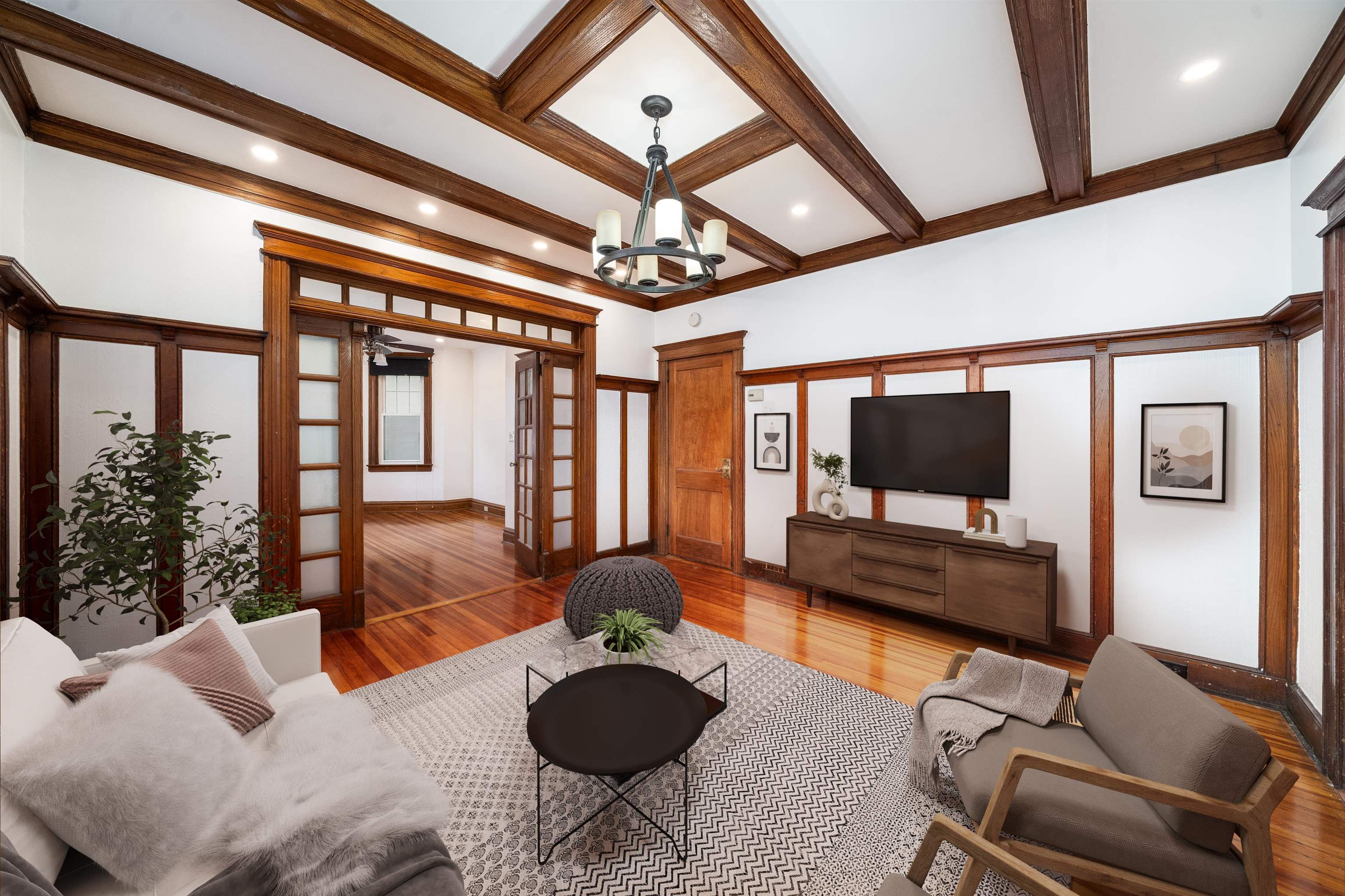 a living room with furniture and a flat screen tv