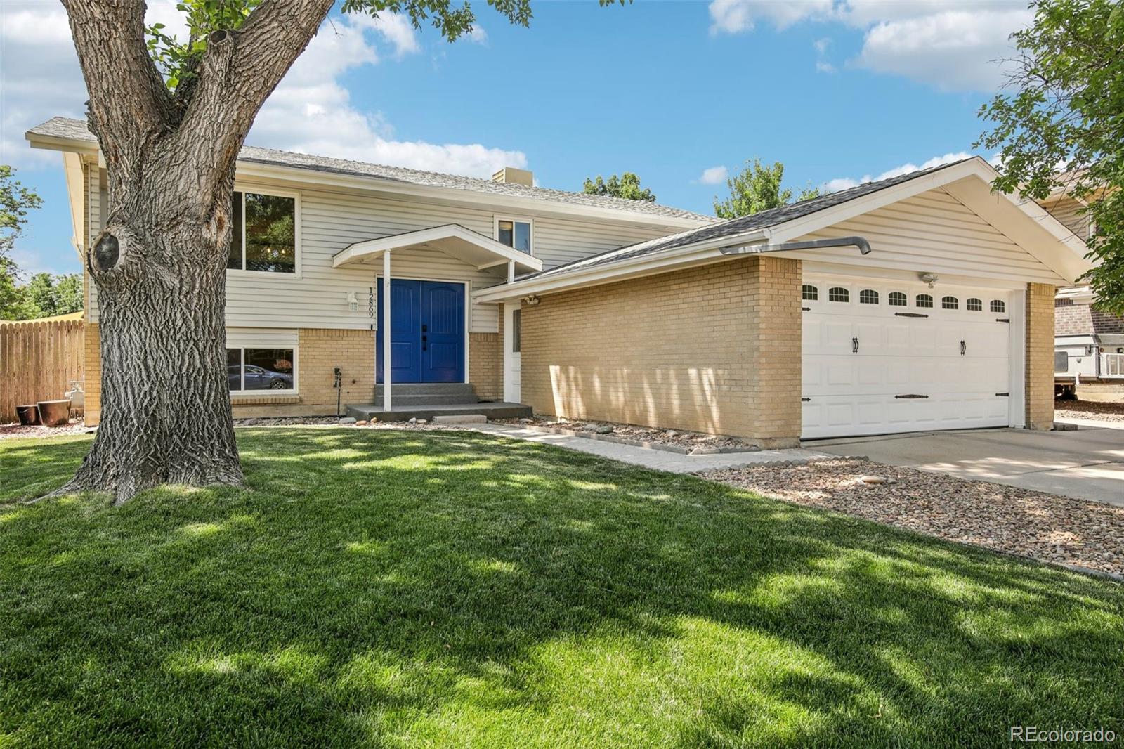 a house with a tree in front of it