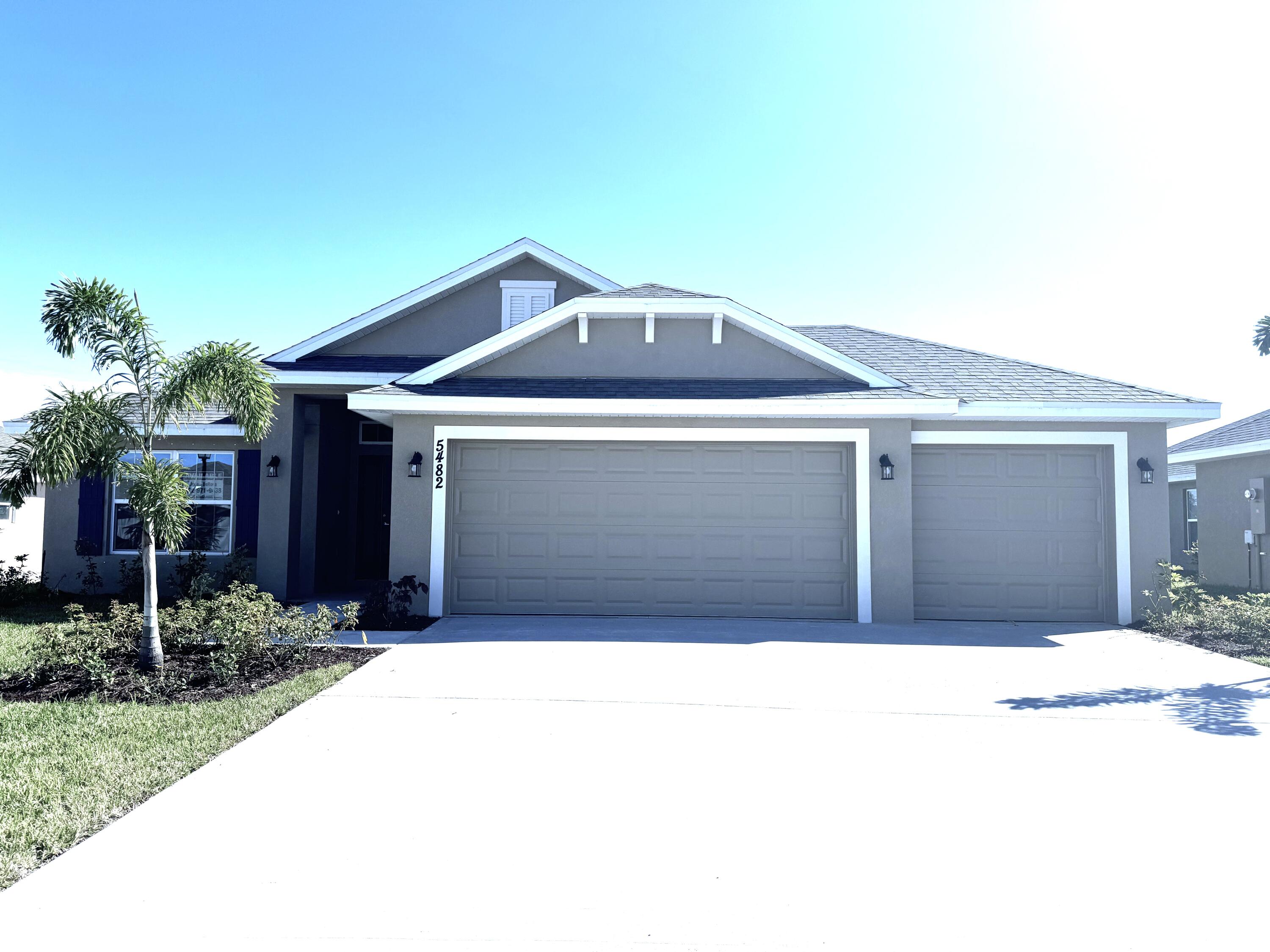 a front view of a house with a garage