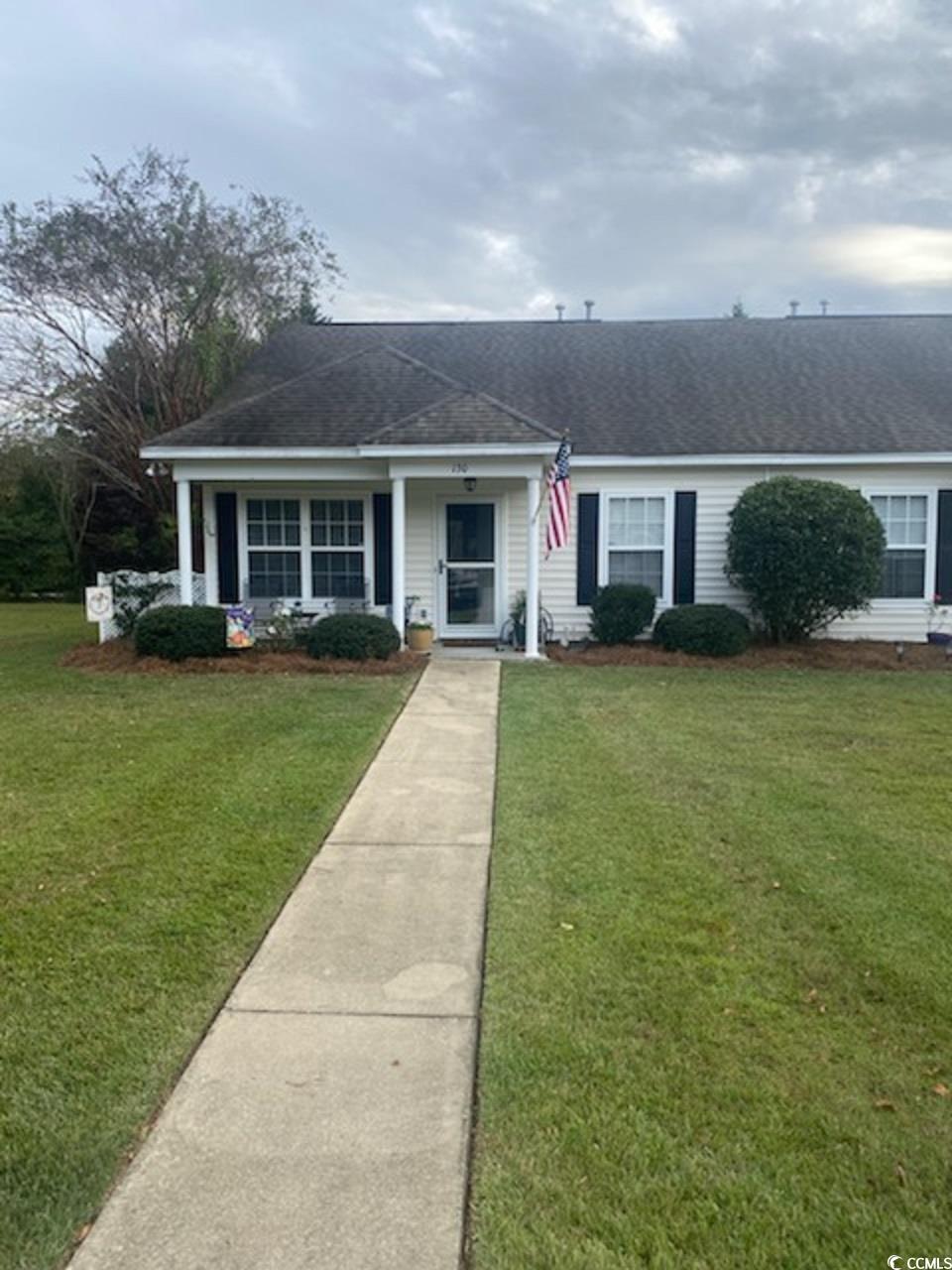 Single story home featuring a front yard