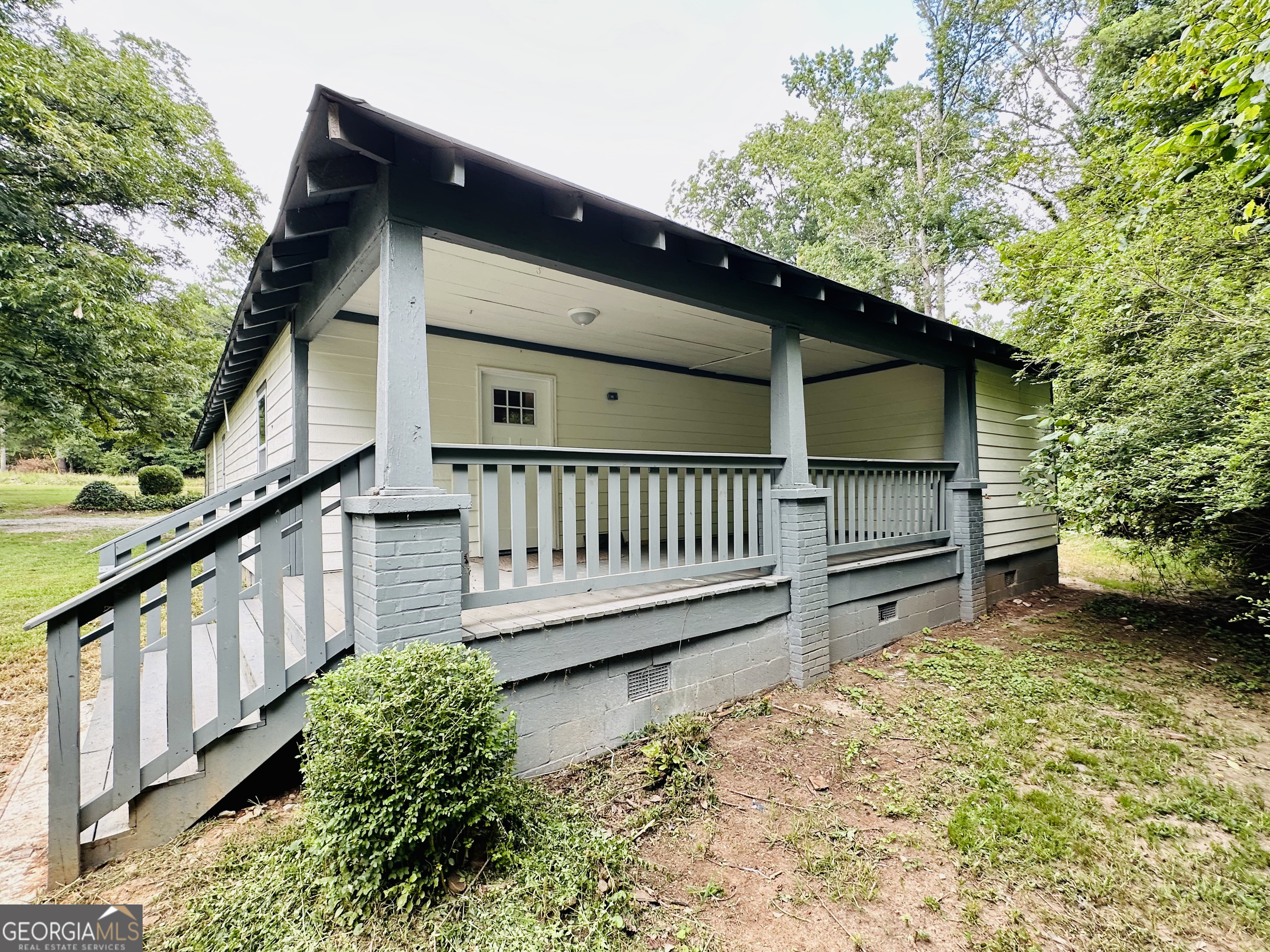 a view of backyard with deck and wooden floor