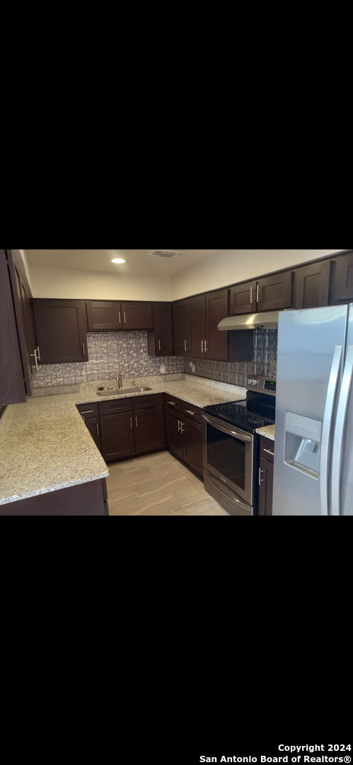 a view of kitchen island with cabinets