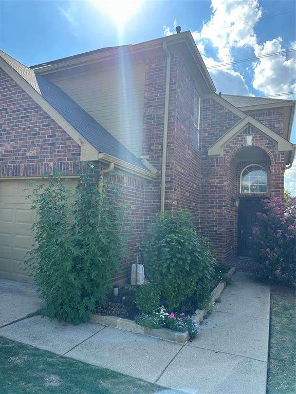 a brick building with a yard