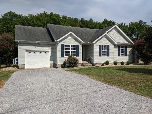 front view of a house with a yard