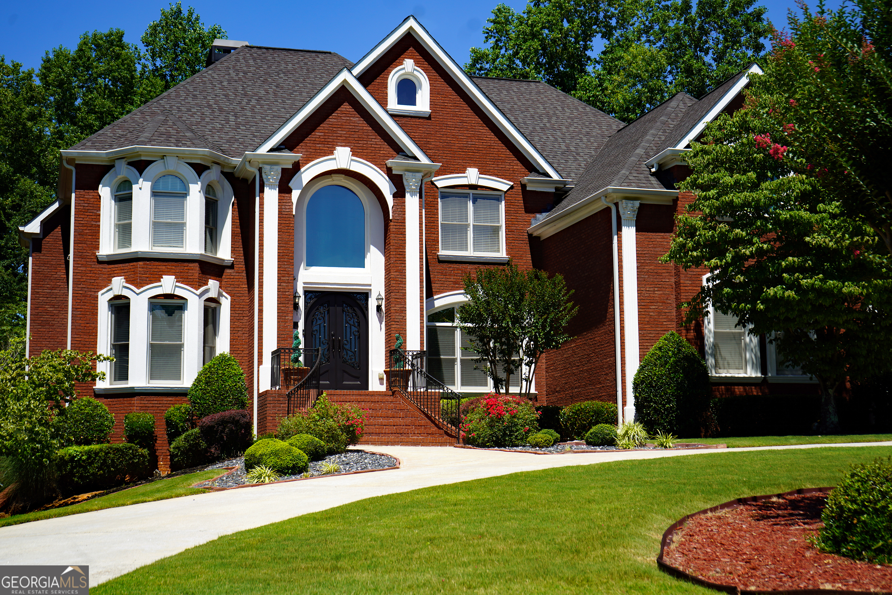 a front view of a house with a yard