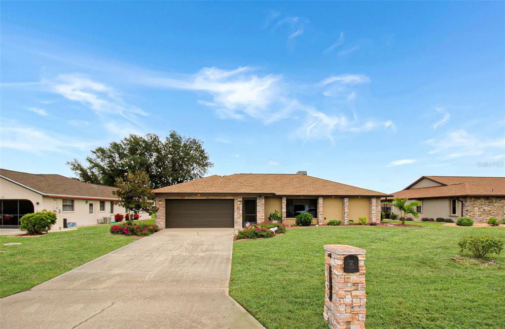 a front view of a house with a yard