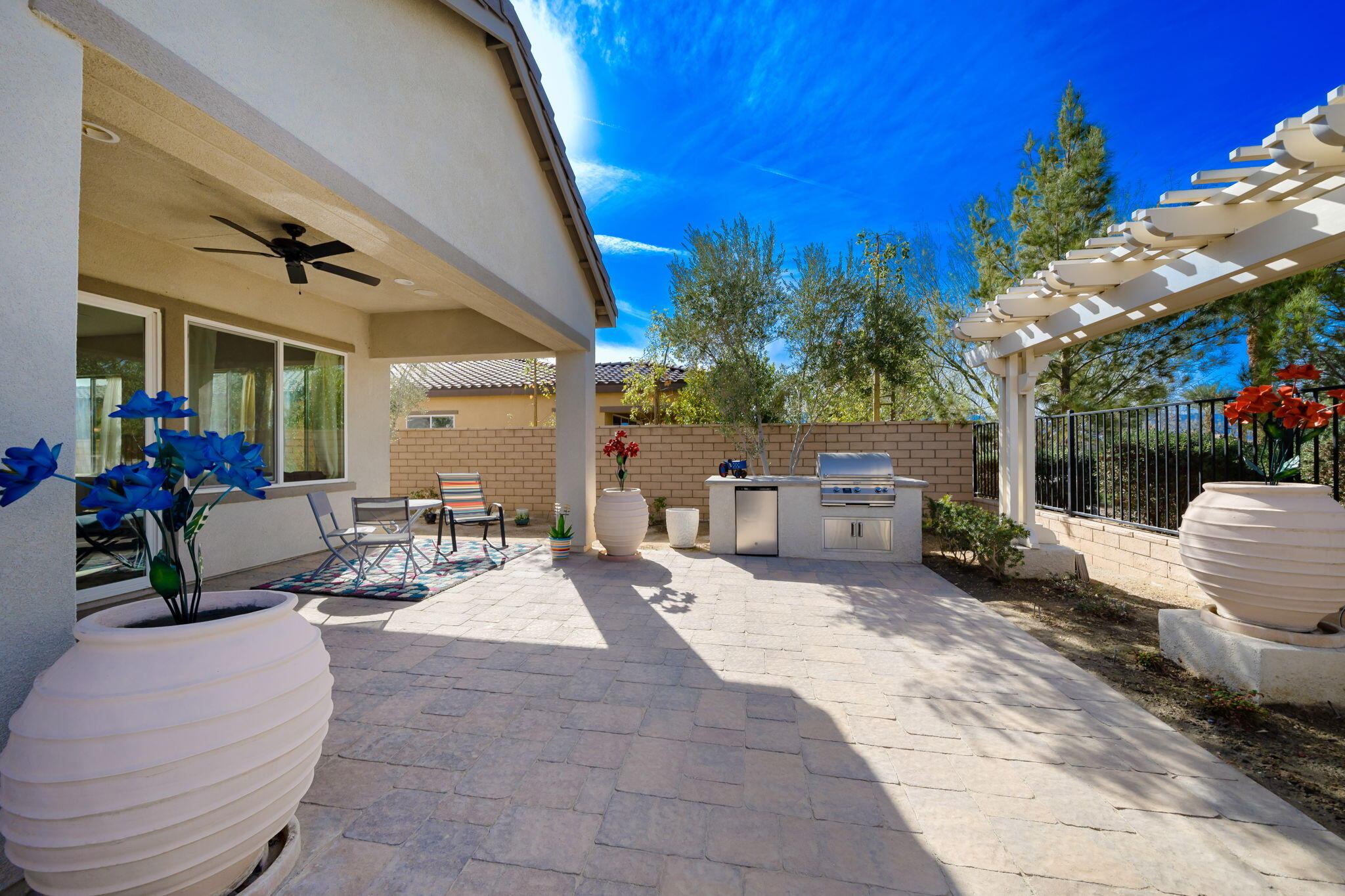 a building outdoor space with patio furniture and potted plants