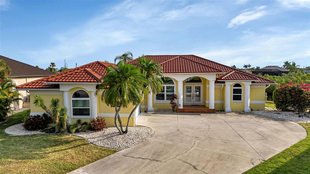 a front view of a house with garden