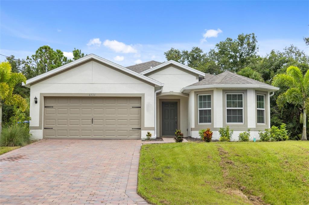 front view of a house with a yard