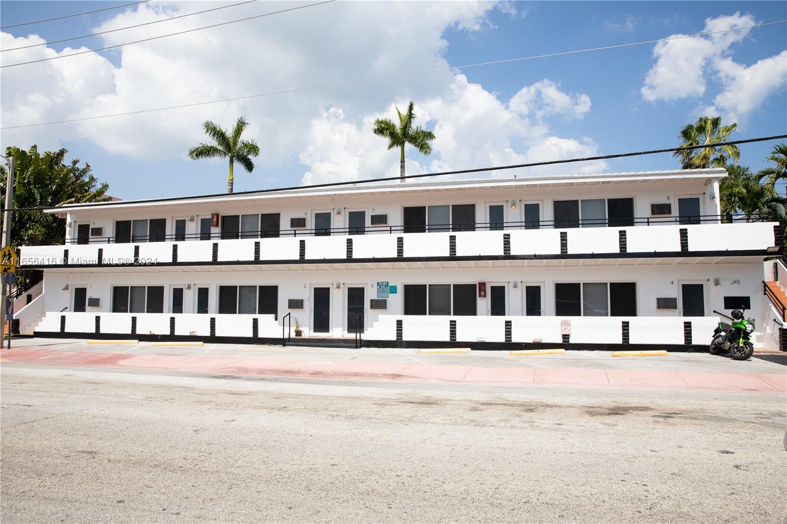 a front view of building with street view