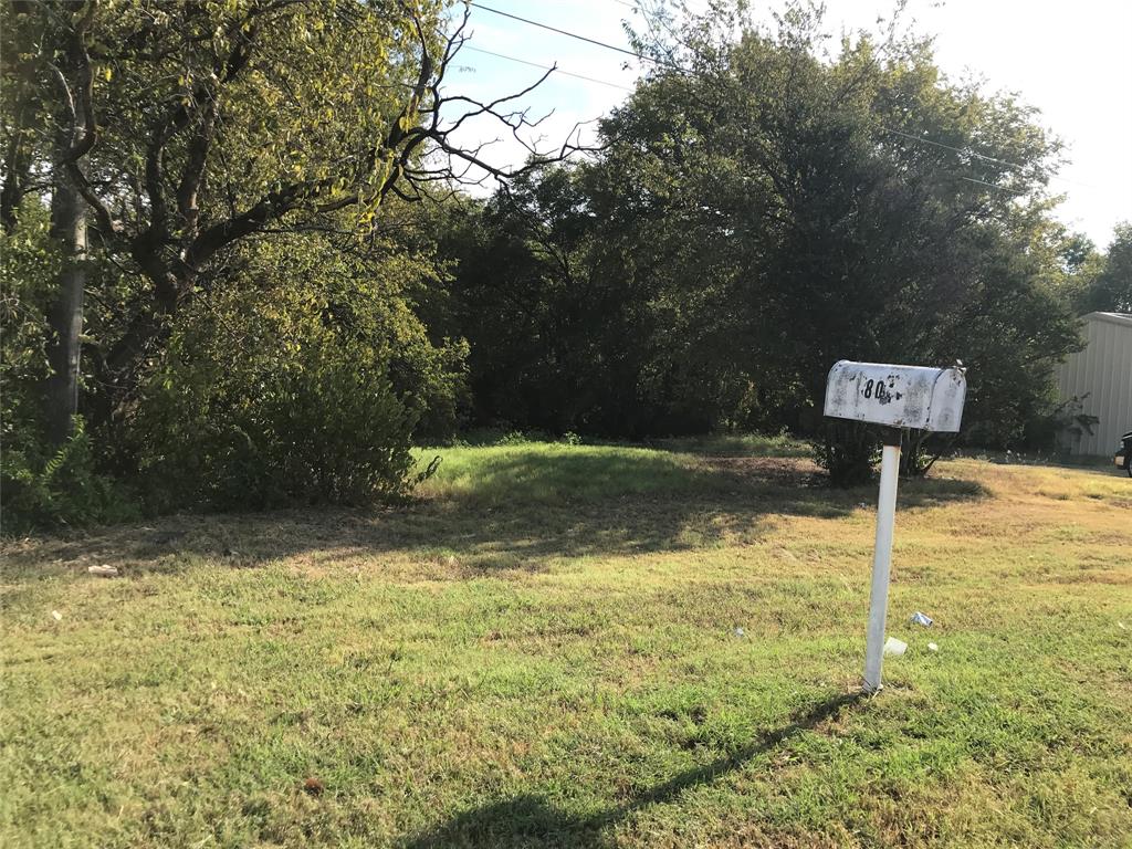 a fire hydrant in the middle of a field